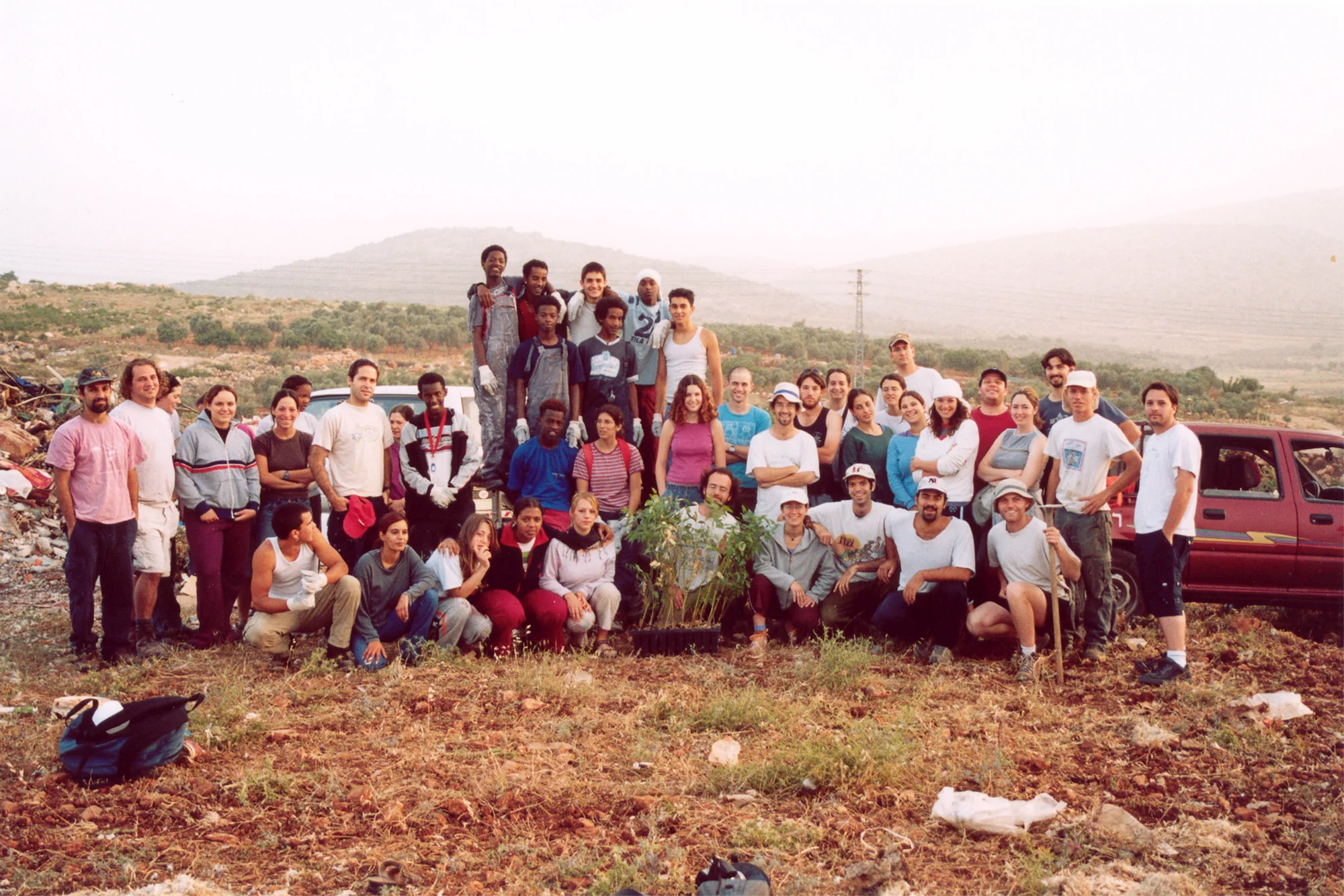 Educators and young people gathered outdoors at Kibbutz Eshbal